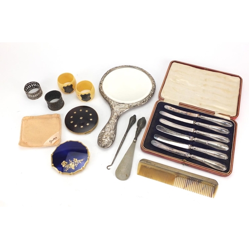 496 - Objects including silver backed hand mirror, vintage compacts and a set of six silver handled butter... 