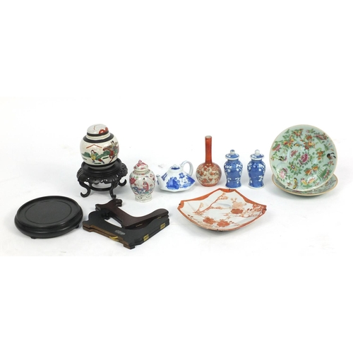 606 - Chinese and Japanese porcelain and woodenwares, including a blue and white teapot  and a Kutani bud ... 