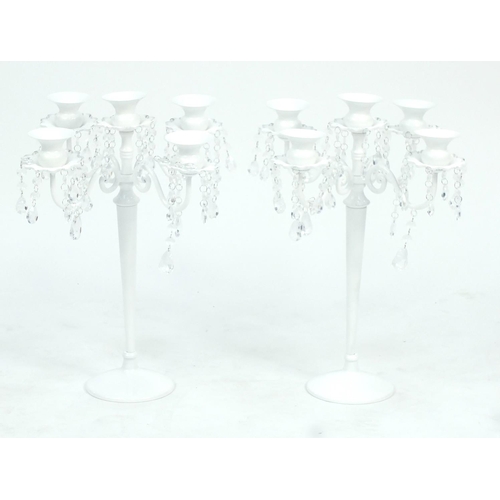 59 - Pair of white painted metal five branch candelabra, with drops, 44.5cm high