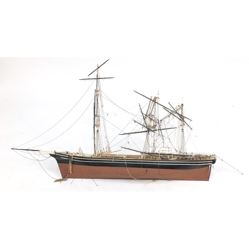 555 - Large wooden model of a rigged sailing ship, 108cm in length