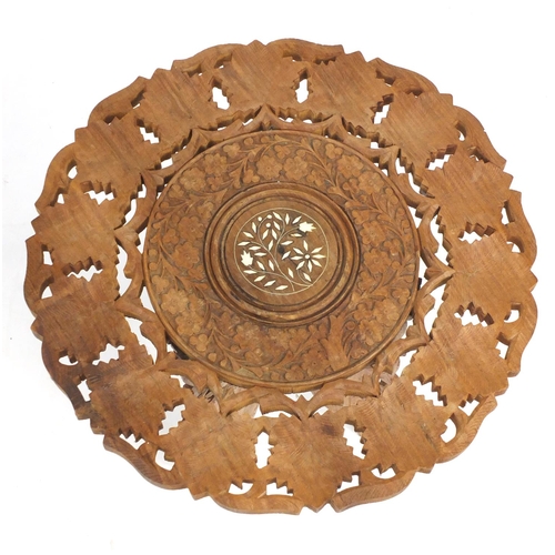 38 - Anglo-Indian folding table carved with leaves, 47cm high x 45cm in diameter