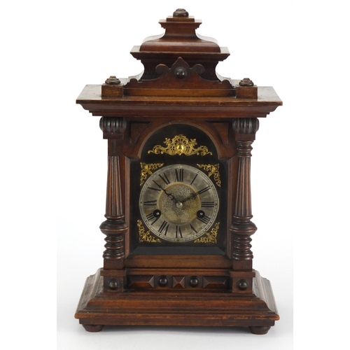 52 - Walnut chiming mantel clock with silvered chapter ring and Roman numerals, 42cm high