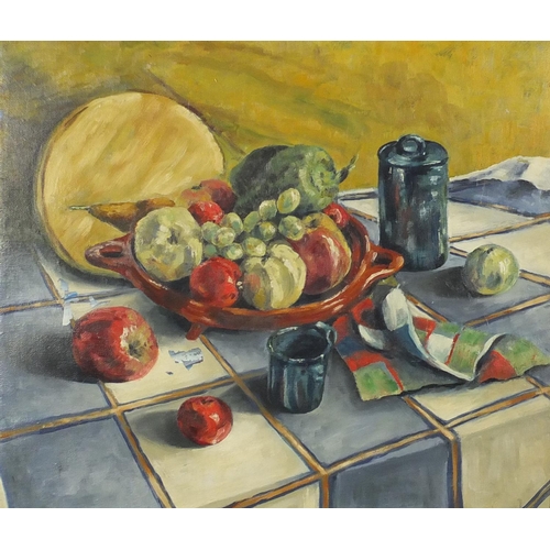 2083 - Still life fruit on a table, oil on canvas, bearing an inscription verso, framed, 52cm x 44cm