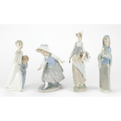 2239 - Three Lladro figuresand one Nao including a girl holding a basket of flowers and a young boy with  g... 