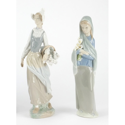 2239 - Three Lladro figuresand one Nao including a girl holding a basket of flowers and a young boy with  g... 