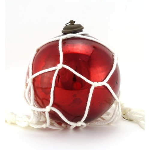 2302 - 19th century red glass witch ball, 23cm high