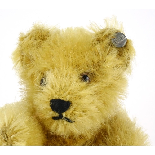 2294 - Miniature golden Steiff teddy bear with articulated limbs, 13.5cm high