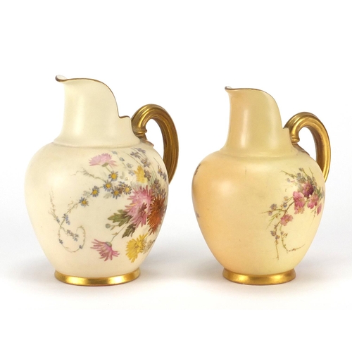 2278 - Two Royal Worcester blush ivory jugs decorated with flowers, both with factory marks and numbered 10... 