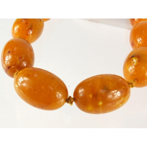 2874 - Butterscotch amber coloured graduated bead necklace, 100cm in length, approximate weight 157.5g