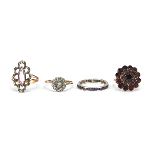 2644 - Four antique rings set with assorted stones including sapphires, garnet and marcasite, various sizes... 