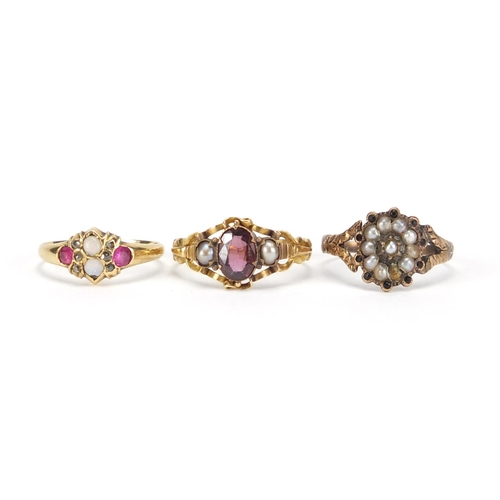 2625 - Three antique rings comprising 18ct gold garnet and seed pearl, unmarked gold opal, ruby and diamond... 