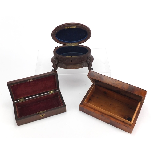 2245 - Woodenware including a black forest casket with carved dog finial and a rectangular rosewood pen box... 