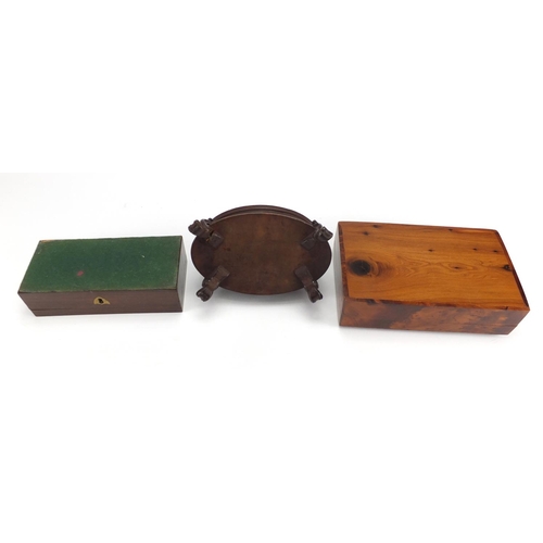 2245 - Woodenware including a black forest casket with carved dog finial and a rectangular rosewood pen box... 