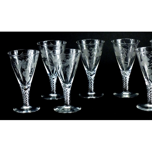 2228 - Eight Stuart crystal glasses with air twist stems, etched with leaves and berries, each 19cm high