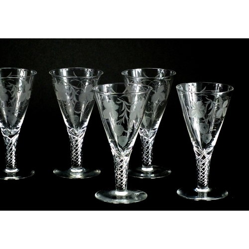 2228 - Eight Stuart crystal glasses with air twist stems, etched with leaves and berries, each 19cm high