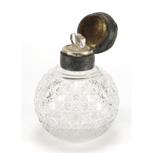 2590 - Victorian globular cut glass scent bottle, the hinged lid embossed with figures and flowers, retaile... 