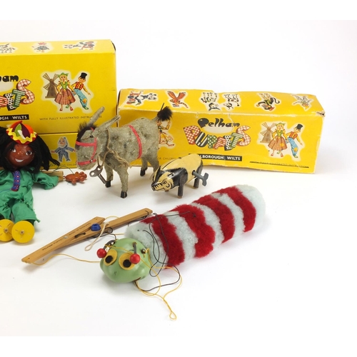 2293 - Three Pelham puppets a golden straw filled teddy bear and two clockwork animals