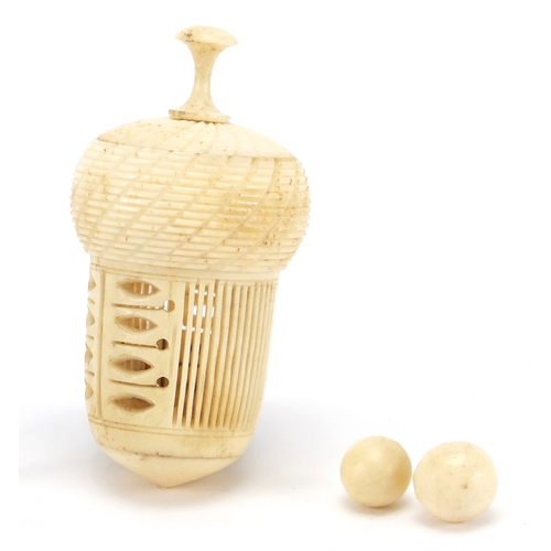 59 - 19th century bone acorn thimble case and a set of miniature bone skittles with two balls, the larges... 