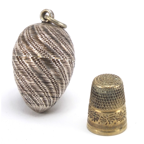 60 - Victorian vegetable ivory cotton winder and a unmarked silver egg design thimble case, the largest 4... 