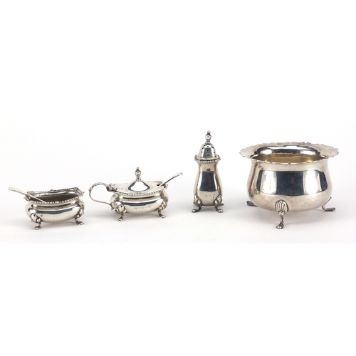 600 - Circular silver three footed bowl and silver three piece cruet, the bowl hallmarked Birmingham 1902,... 