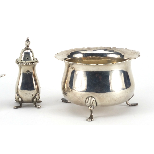 600 - Circular silver three footed bowl and silver three piece cruet, the bowl hallmarked Birmingham 1902,... 