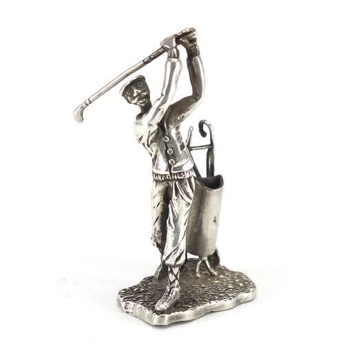615 - Silver figure of a golfer with caddy, indistinct impressed marks to the base, 6.5cm high, approximat... 