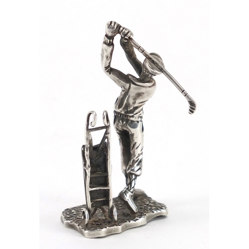 615 - Silver figure of a golfer with caddy, indistinct impressed marks to the base, 6.5cm high, approximat... 