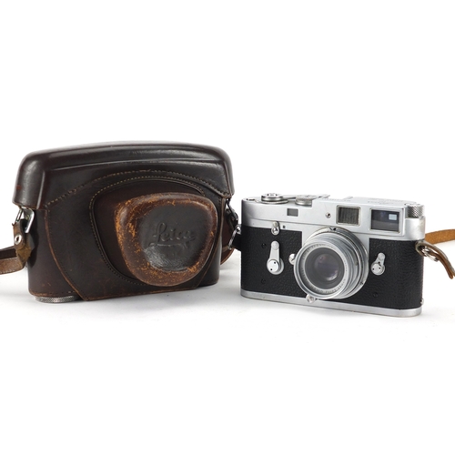 99 - Leica M2 Rangefinder Camera with Elmar lens and leather case, the camera serial number 1103653