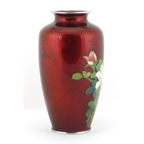 320 - Japanese cloisonné vase enamelled with flowers and decorated with a bird of paradise, 18.5cm high