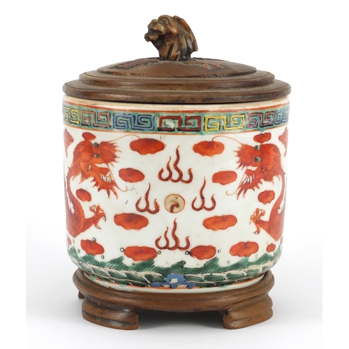 283 - Chinese porcelain iron red brush pot with carved hardwood cover on hardwood stand, hand painted with... 
