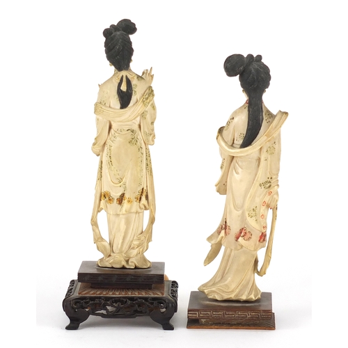 350 - Pair of Japanese part stained carved ivory okimono's of Geisha girls, each raised on carved hardwood... 