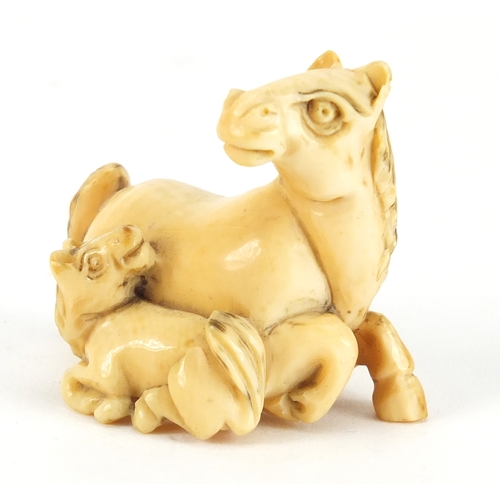 355 - Japanese carved ivory Netsuke of a horse and foal, incised marks to the underside, 4.2cm wide