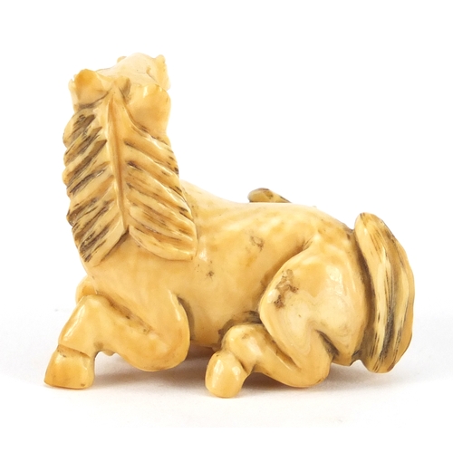 355 - Japanese carved ivory Netsuke of a horse and foal, incised marks to the underside, 4.2cm wide