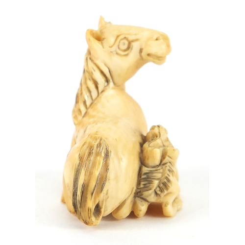 355 - Japanese carved ivory Netsuke of a horse and foal, incised marks to the underside, 4.2cm wide