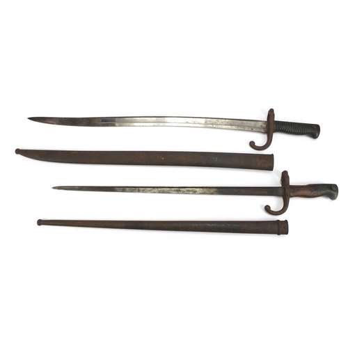 234 - Two French Military long bayonets with scabbards,  both with impressed marks, the largest 71.5cm in ... 