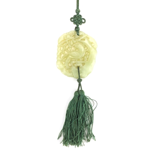 341 - Chinese green jade pendant carved with a bird of paradise on necklace, the pendant 6cm x 5cm