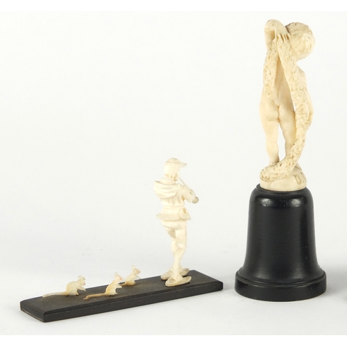 58 - Three ivory carvings comprising a Dieppe nude boy, the Pied Piper and St George and the dragon, each... 