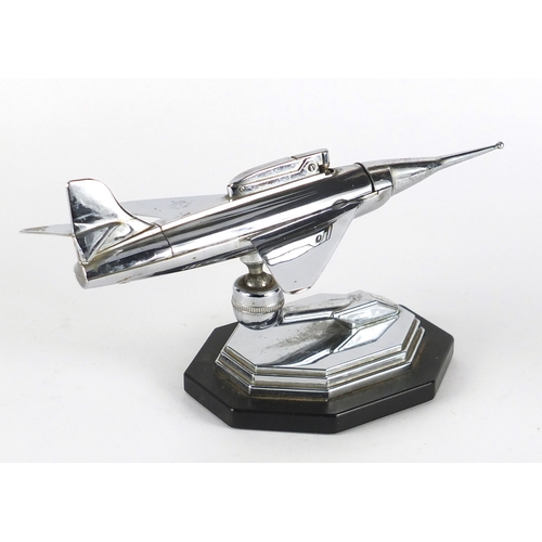 563 - Vintage novelty chrome table lighter in the form of an aeroplane with gimbal stand, reg no to the ba... 