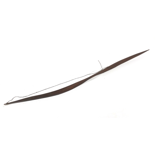 371 - Andaman Islands wood bow of double paddle form, with incised decoration, 197cm in length