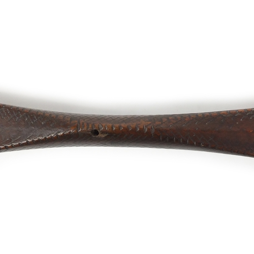 371 - Andaman Islands wood bow of double paddle form, with incised decoration, 197cm in length