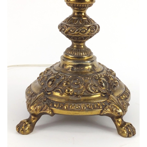 2313 - Ornate brass lamp with paw feet and shade, over all 77cm high