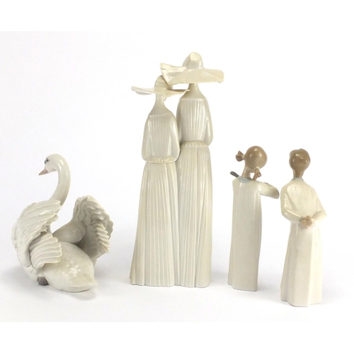 2138 - Four Lladro figures including two nuns and a swan, the largest 33cm high