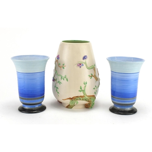 2346 - Clarice Cliff Newport pottery naturalistic vase and a pair of Shelley Ribbed patterned vases, the la... 