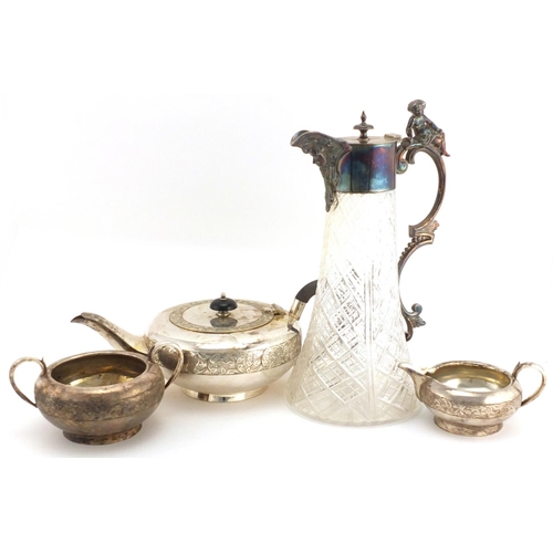 2267 - Silver plated three piece tea service and a cut glass claret jug with silver plated mounts and figur... 