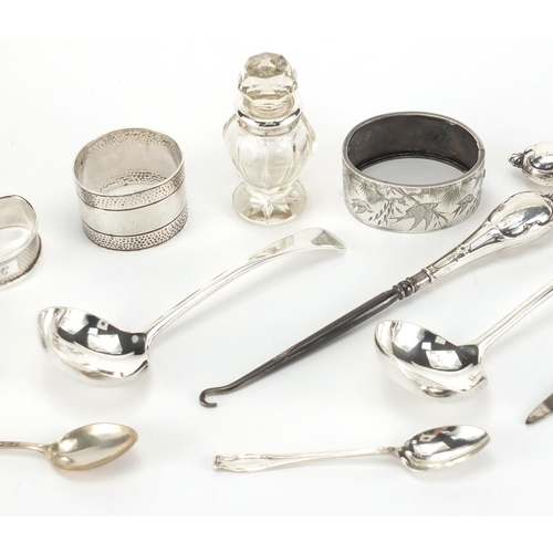 2610 - *WITHDRAWN* Silver objects including a Victorian bangle engraved with birds, spoons, napkin ring and... 