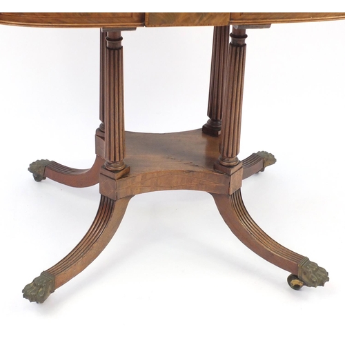 2002 - Regency inlaid walnut fold over card table, raised with quadruple fluted columns with brass paw feet... 