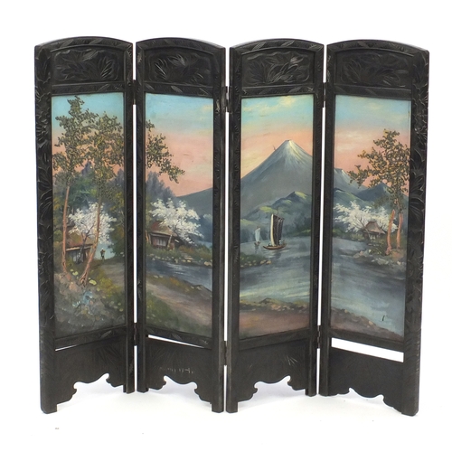 2066 - Oriental carved ebonised four fold screen, hand painted with a view of Mount Fuji, 90cm H x 106cm W