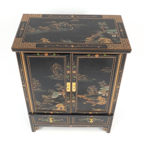 2027 - Black lacquered chinoiserie cabinet, fitted with a pair of cupboard doors above to base drawers, 93c... 