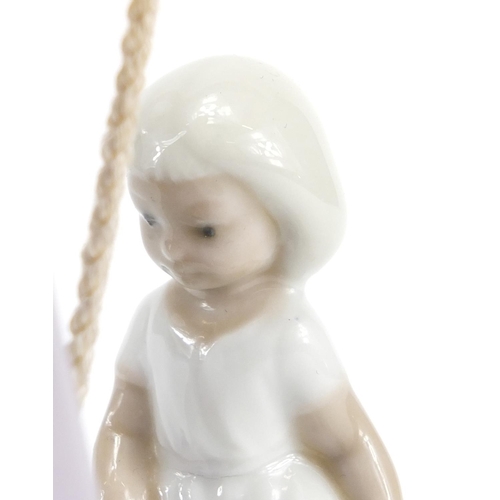 2155 - Lladro figurine of a girl pulling a cart with a doll, 27.5cm high