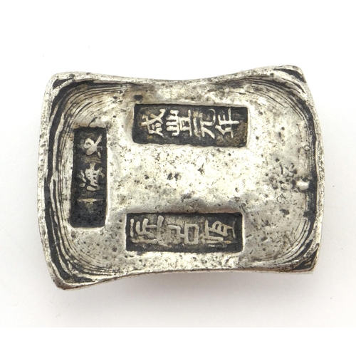2313 - Chinese silver coloured metal scroll weight, 3.7cm wide, approximate weight 201.7g